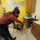 Belinda Smith, owner of Styles of Essence, a hair salon in south Jackson, Miss., points out the gallons of water stored under each sink, available to use for rinsing clients hair because of the uncertainty of the city’s water service, Wednesday, Jan. 26, 2022. The city’s ongoing water woes sometimes requires the area water to be shut off without warning.